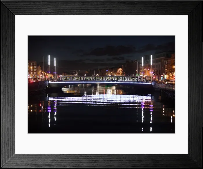 Framed Print : A tram crosses a bridge over the river Liffey at night in Dublin Framed Print : A tram crosses a bridge over the river Liffey at night in Dublin