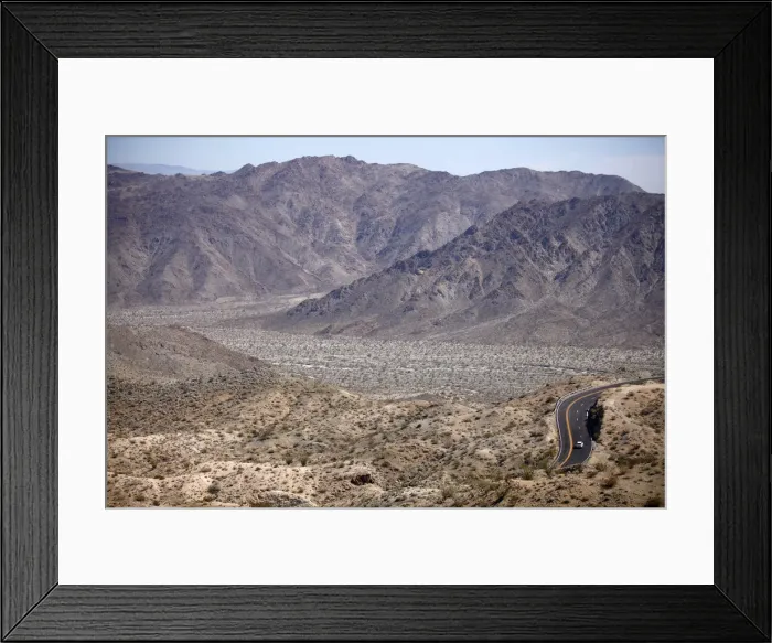 Framed Print : Automobile travels through California desert mountains Framed Print : Automobile travels through California desert mountains