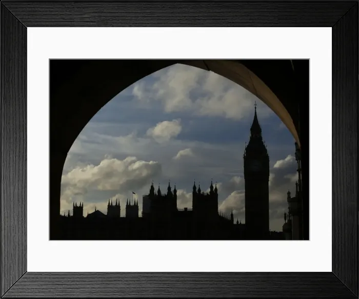 Framed Print : The Houses of Parliament and Big Ben are silhouetted against the sky in London