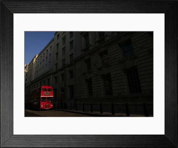Framed Print : A bus is parked in a street in central London Framed Print : A bus is parked in a street in central London