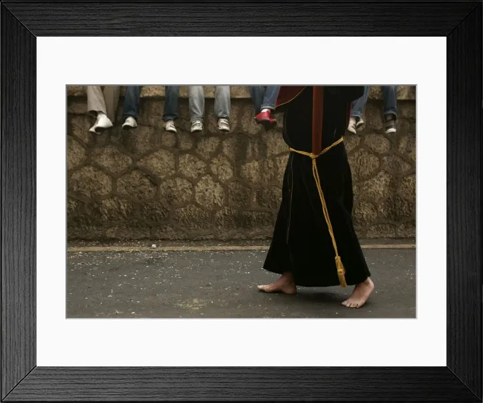 Framed Print : Penitent takes part in the procession of Penas brotherhood during Holy Week in Malaga Framed Print : Penitent takes part in the procession of Penas brotherhood during Holy Week in Malaga