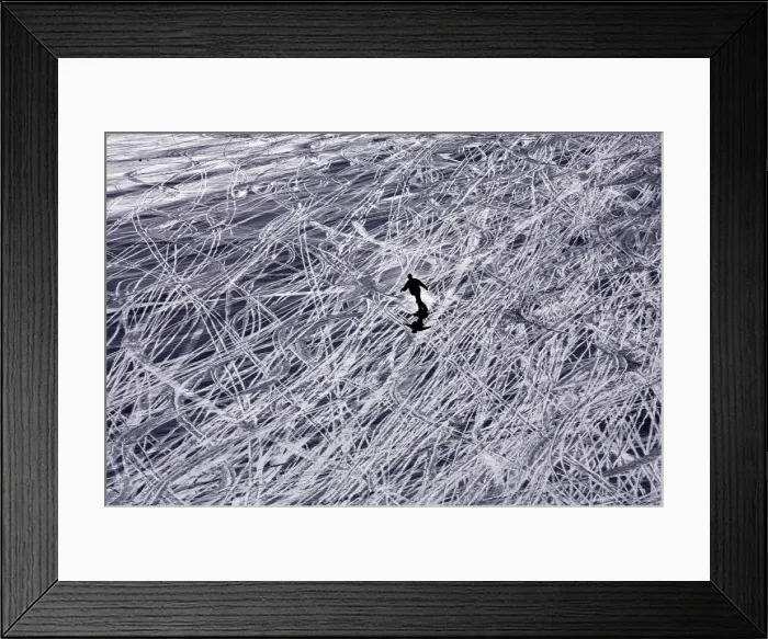 Framed Print : A tourist skis down Maso Corto mountain in Italy