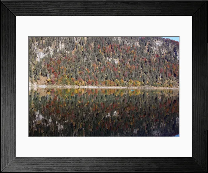 Framed Print : A fisherman rows his boat during a sunny autumn day at the Sylvenstein barrier lake Framed Print : A fisherman rows his boat during a sunny autumn day at the Sylvenstein barrier lake