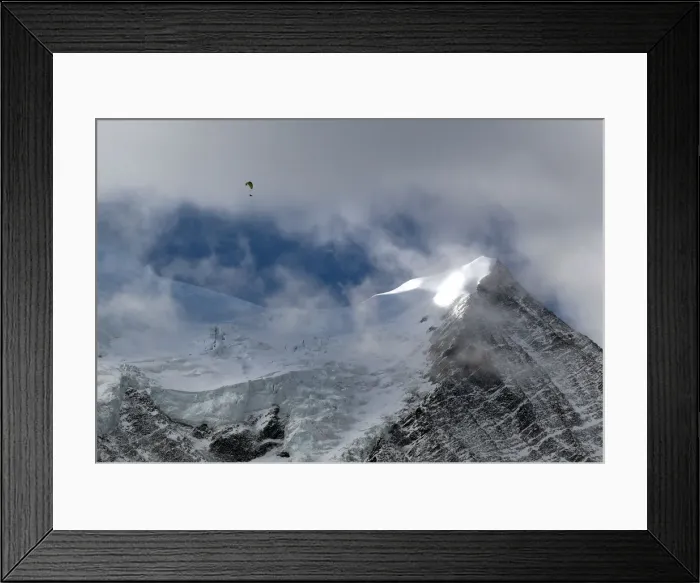 Framed Print : A paraglider flies above the Bossons glacier in the Mont-Blanc massif on a sunny autumn Framed Print : A paraglider flies above the Bossons glacier in the Mont-Blanc massif on a sunny autumn