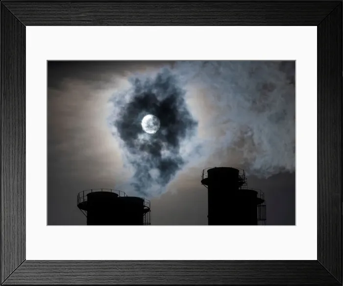 Framed Print : Sun shines through steam rising from chimneys of a power plant in Moscow Framed Print : Sun shines through steam rising from chimneys of a power plant in Moscow