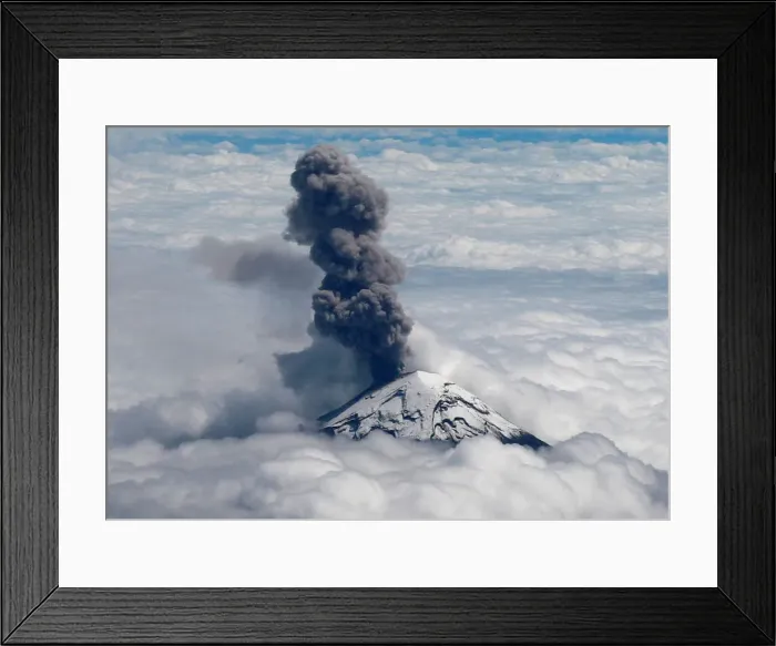 Framed Print : A general view shows the Popocatepetl volcano spews a cloud of ash high into the air as Framed Print : A general view shows the Popocatepetl volcano spews a cloud of ash high into the air as