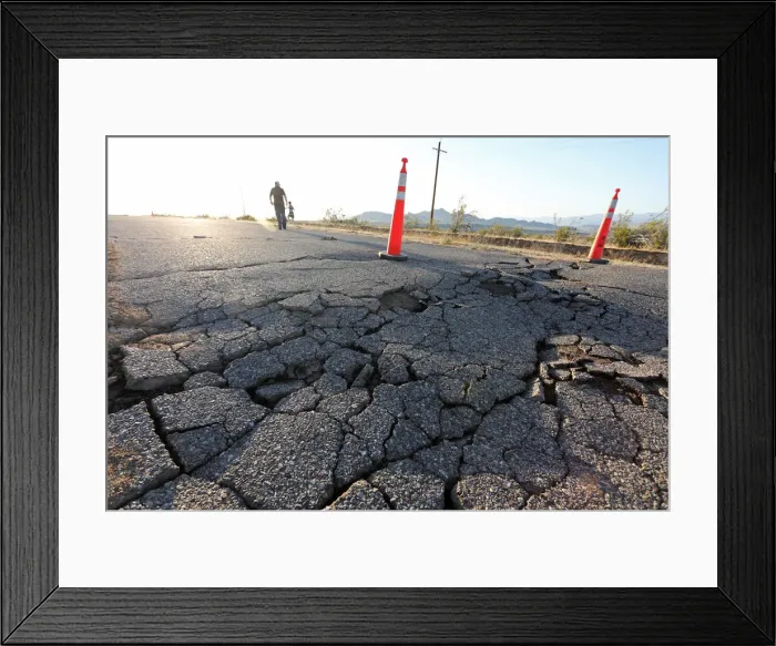 Framed Print : Fissures that opened up under a highway during a powerful earthquake that struck Southern Framed Print : Fissures that opened up under a highway during a powerful earthquake that struck Southern