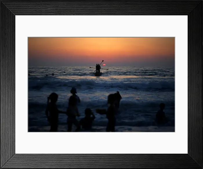 Framed Print : Palestinians ride a boat in the Mediterranean Sea in the northern Gaza Strip Framed Print : Palestinians ride a boat in the Mediterranean Sea in the northern Gaza Strip