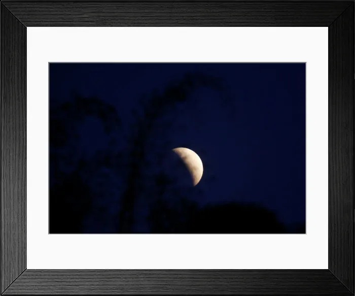 Framed Print : A partial lunar eclipse is seen in Brasilia