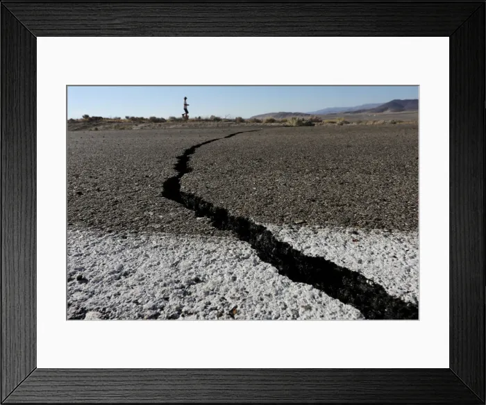 Framed Print : Fissures that opened up under a highway during a powerful earthquake that struck Southern Framed Print : Fissures that opened up under a highway during a powerful earthquake that struck Southern