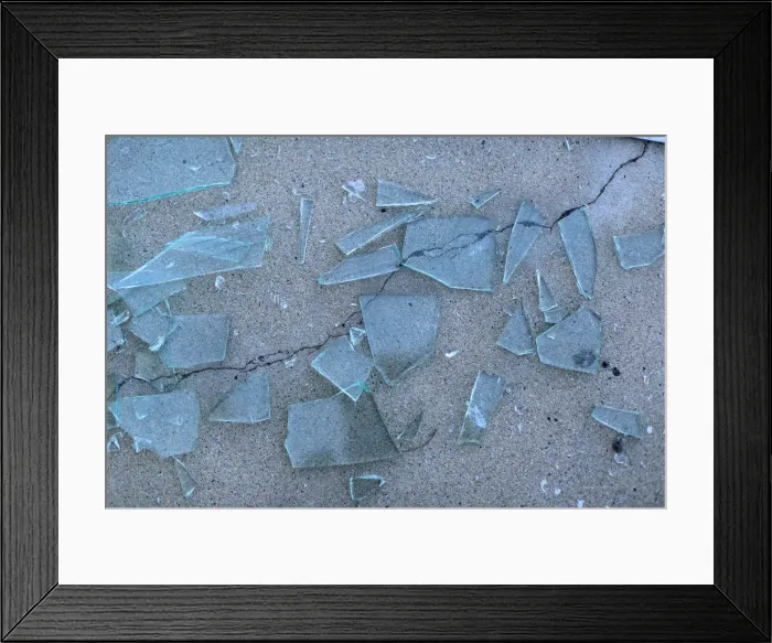 Framed Print : Broken glass is seen after a powerful earthquake struck Southern California near the city Framed Print : Broken glass is seen after a powerful earthquake struck Southern California near the city