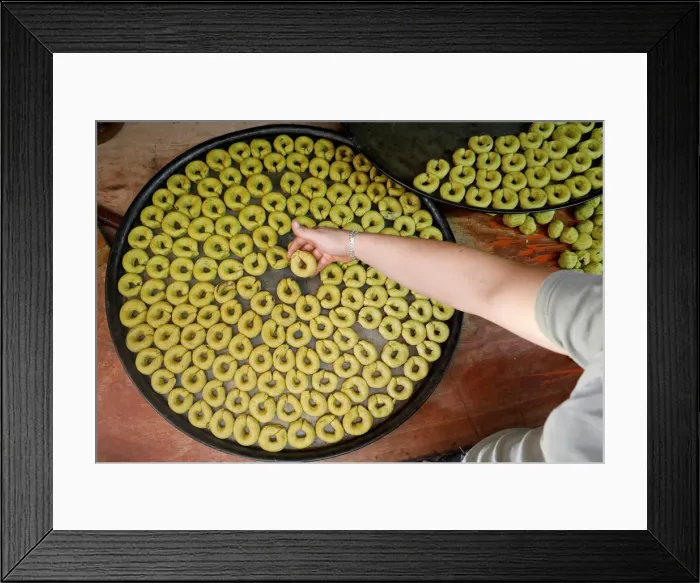 Framed Print : Palestinian man prepares traditional cakes for sale ahead of Muslim holiday of Eid Framed Print : Palestinian man prepares traditional cakes for sale ahead of Muslim holiday of Eid