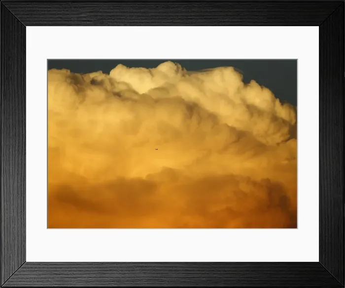 Framed Print : A small aircraft flies past a large emerging thunderstorm during sunset near Encinitas Framed Print : A small aircraft flies past a large emerging thunderstorm during sunset near Encinitas