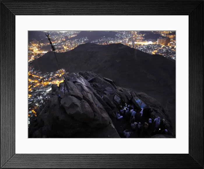 Framed Print : Muslims pray as they visit the Hira cave at the Mount Al-Noor during their Umrah Mawlid Framed Print : Muslims pray as they visit the Hira cave at the Mount Al-Noor during their Umrah Mawlid