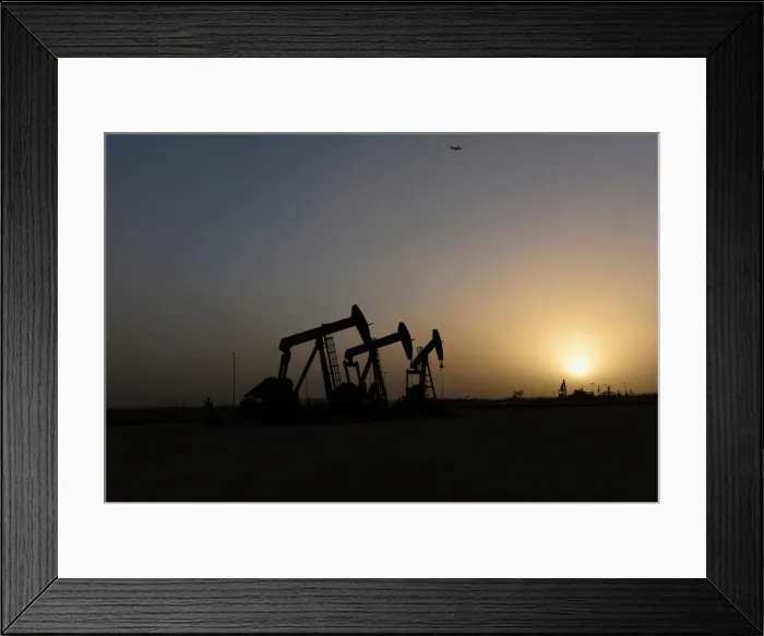 Framed Print : Pump jacks operate at sunset in Midland