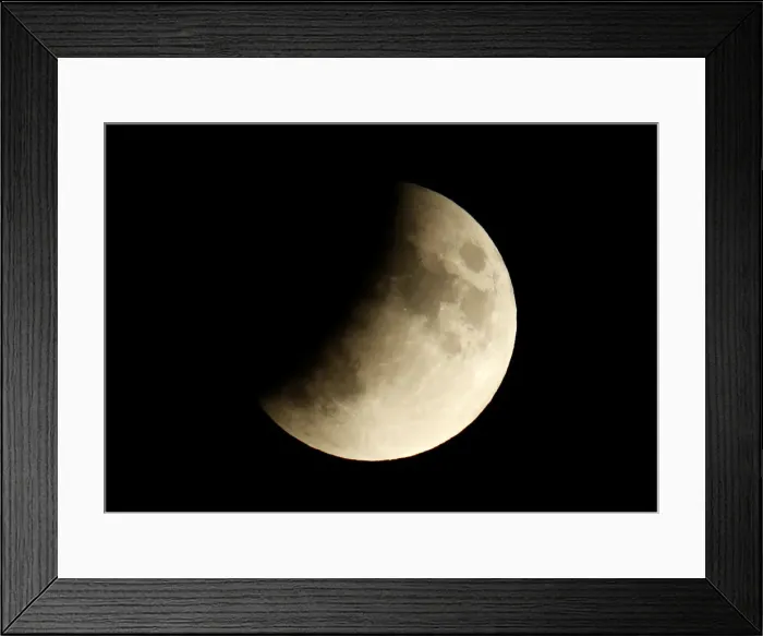 Framed Print : A partial lunar eclipse is seen in Berlin Framed Print : A partial lunar eclipse is seen in Berlin