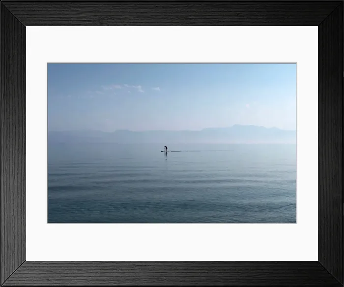 Framed Print : A man paddles in the Ionian Sea near the island of Corfu Framed Print : A man paddles in the Ionian Sea near the island of Corfu