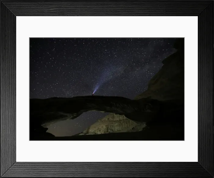 Framed Print : A man watches the stars seen on the sky of Al-Kharza area in Wadi Rum in the south of