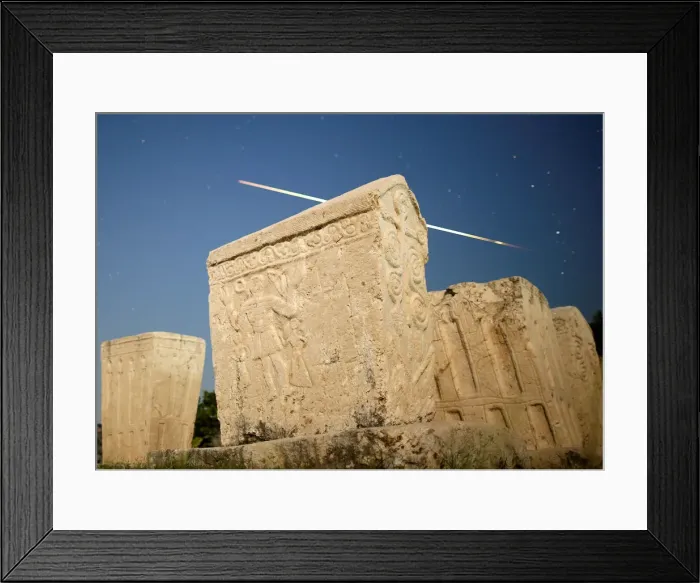Framed Print : A meteor streaks past stars in the night sky above medieval tombstones during the Perseid Framed Print : A meteor streaks past stars in the night sky above medieval tombstones during the Perseid