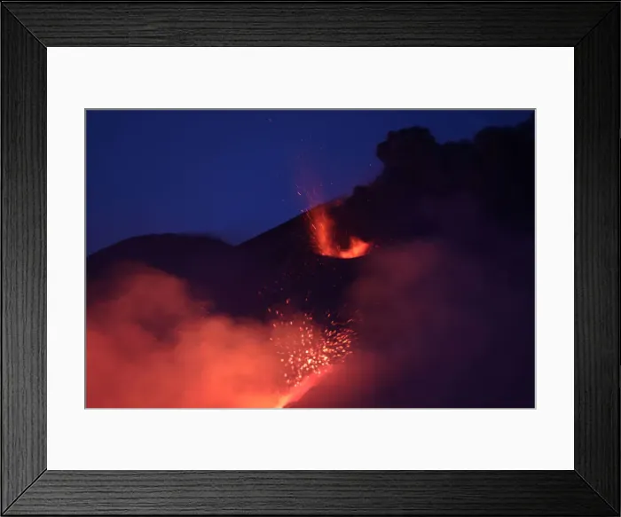 Framed Print : Lava and plumes of smoke erupt from Mount Etna