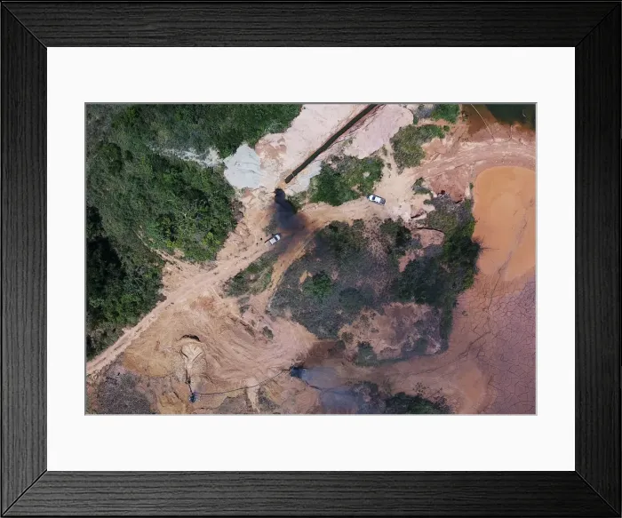 Framed Print : An aerial view shows machines being destroyed during an operation conducted by Framed Print : An aerial view shows machines being destroyed during an operation conducted by