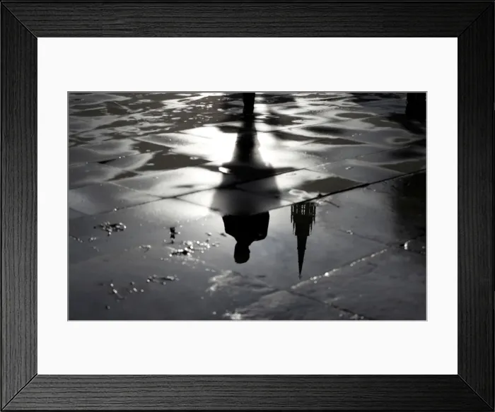 Framed Print : The Palace of Westminster and a man walking are reflected in a puddle in London Framed Print : The Palace of Westminster and a man walking are reflected in a puddle in London