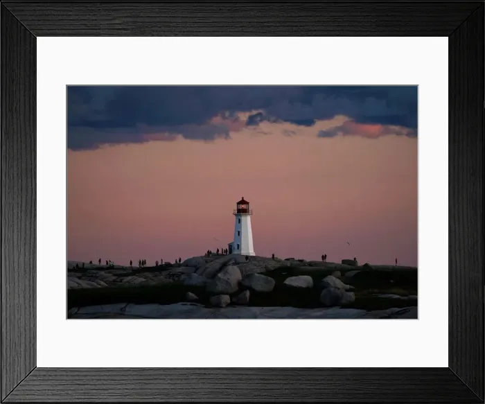 Framed Print : People walk on the rocks at the lighthouse at dusk in Peggys Cove Framed Print : People walk on the rocks at the lighthouse at dusk in Peggys Cove