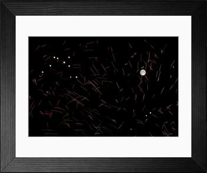 Framed Print : Fireworks explode in front of the full moon during celebrations marking the feast of Framed Print : Fireworks explode in front of the full moon during celebrations marking the feast of