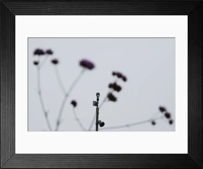 Framed Print : A surveillance camera is seen in the Kings Cross area in London