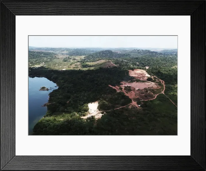 Framed Print : An aerial view shows the location of an illegal gold mine as its machines are destroyed