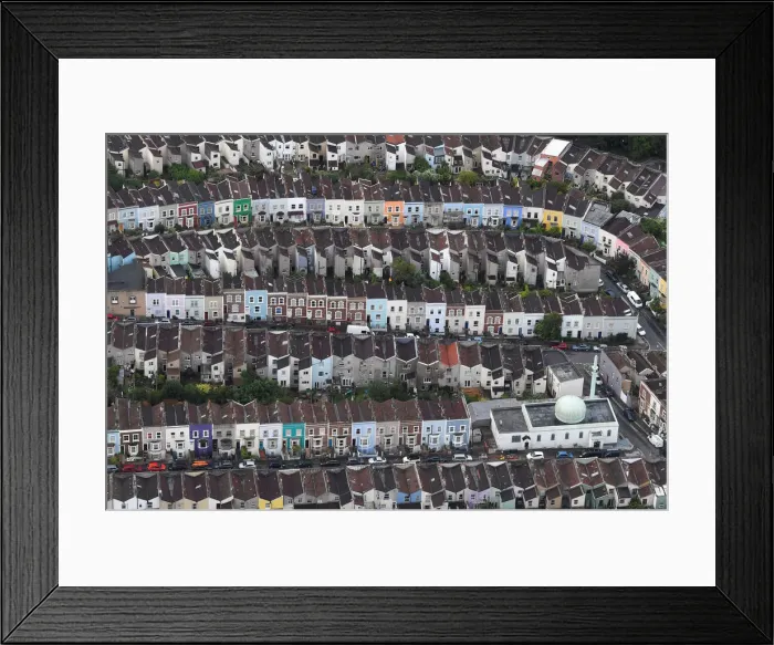Framed Print : A mosque is seen amongst residential housing from the air during a mass take off