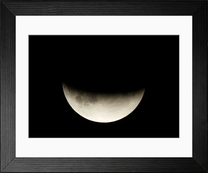 Framed Print : A partial lunar eclipse is seen in Berlin