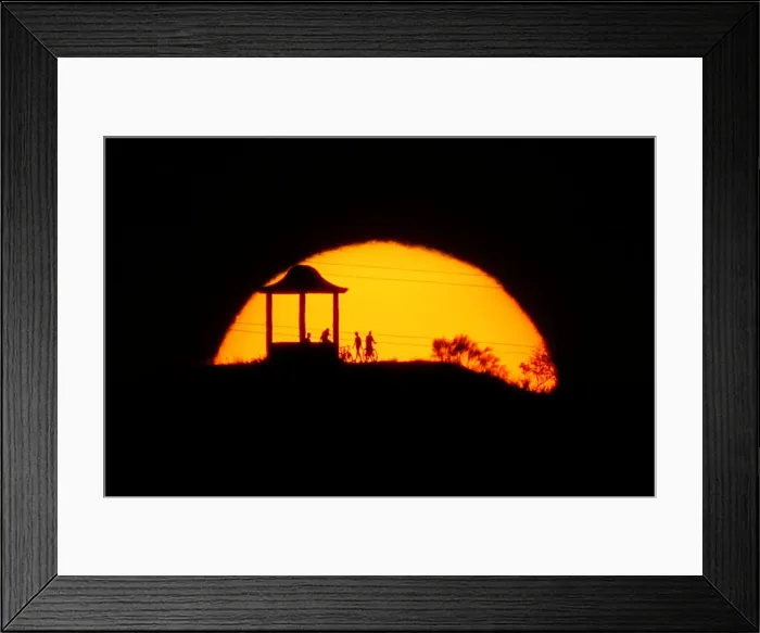 Framed Print : People are silhouetted against the setting sun at El Mirador de la Alemana in Malaga Framed Print : People are silhouetted against the setting sun at El Mirador de la Alemana in Malaga