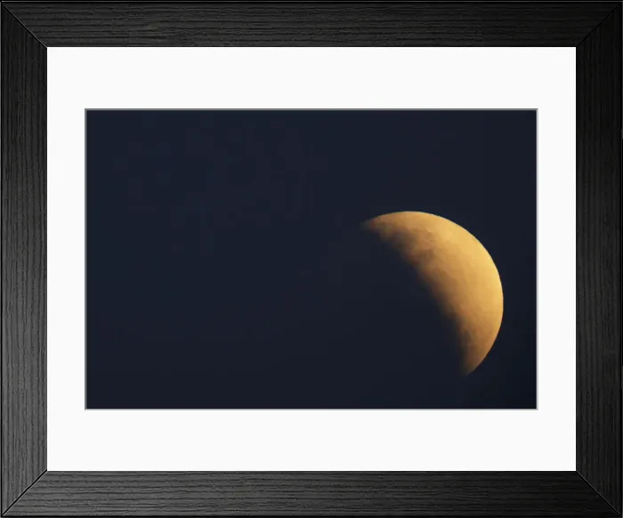 Framed Print : A moon is seen during a partial lunar eclipse in Brasilia