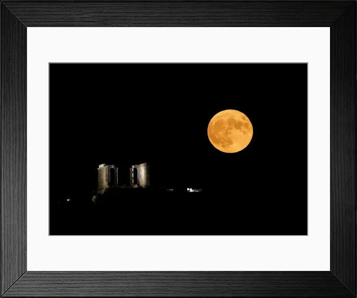 Framed Print : A full moon rises behind the Temple of Poseidon in Cape Sounion, near Athens