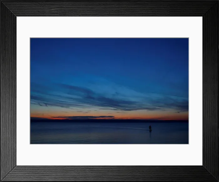 Framed Print : A person is seen during sunset at lake Neusiedl in Podersdorf Framed Print : A person is seen during sunset at lake Neusiedl in Podersdorf