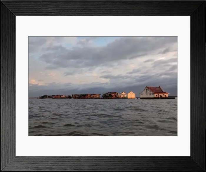 Framed Print : The Wider Image: Rising seas threaten early end for sinking village in Philippines Framed Print : The Wider Image: Rising seas threaten early end for sinking village in Philippines