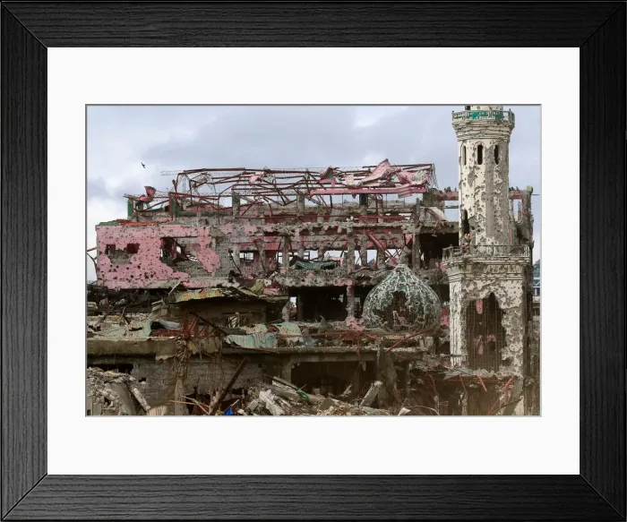 Framed Print : Damaged houses, buildings and a mosque are seen inside Marawi city Framed Print : Damaged houses, buildings and a mosque are seen inside Marawi city