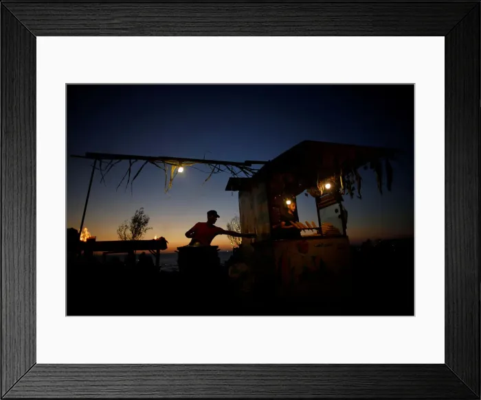 Framed Print : Palestinian vendors sell corns on the beach in Gaza City