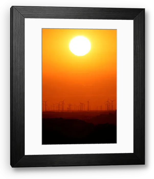 Framed Print : Power-generating windmill turbines are pictured during sunset from the Drachenberg hill Framed Print : Power-generating windmill turbines are pictured during sunset from the Drachenberg hill