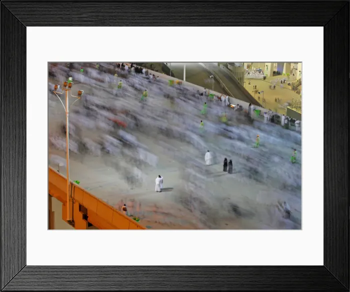 Framed Print : Muslim pilgrims walk to cast their stones at a pillar symbolising the stoning of Satan Framed Print : Muslim pilgrims walk to cast their stones at a pillar symbolising the stoning of Satan