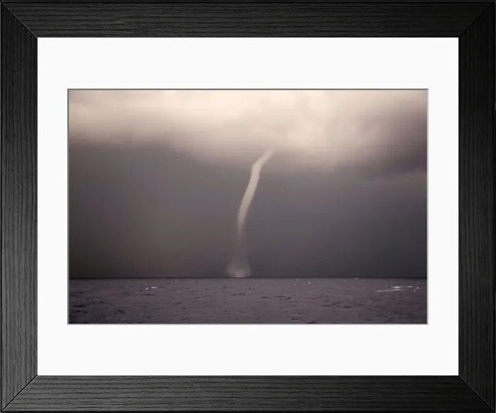 Framed Print : A waterspout is seen from the German NGO Sea-Eye migrant rescue ship Alan Kurdi as it
