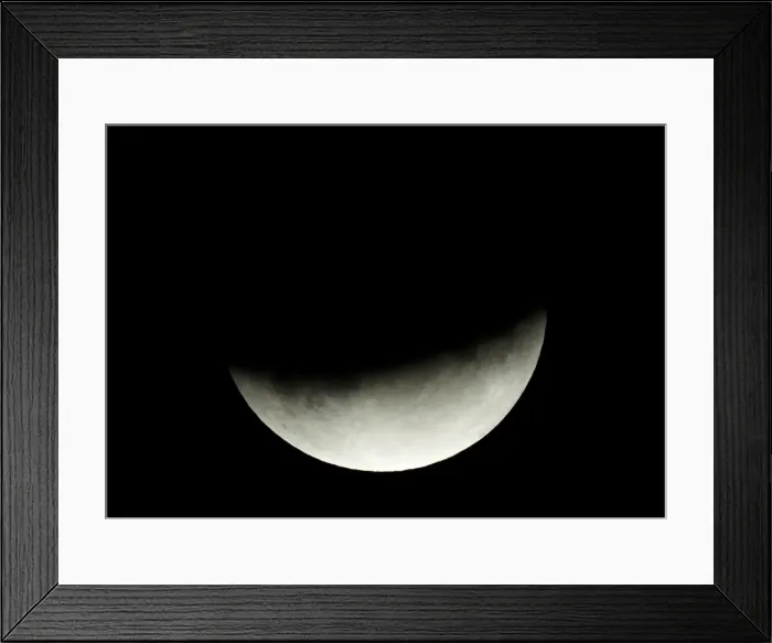 Framed Print : A partial lunar eclipse is seen in Berlin Framed Print : A partial lunar eclipse is seen in Berlin