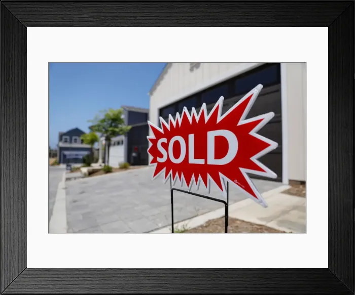 Framed Print : A newly constructed single family home is shown as sold in Encinitas, California Framed Print : A newly constructed single family home is shown as sold in Encinitas, California