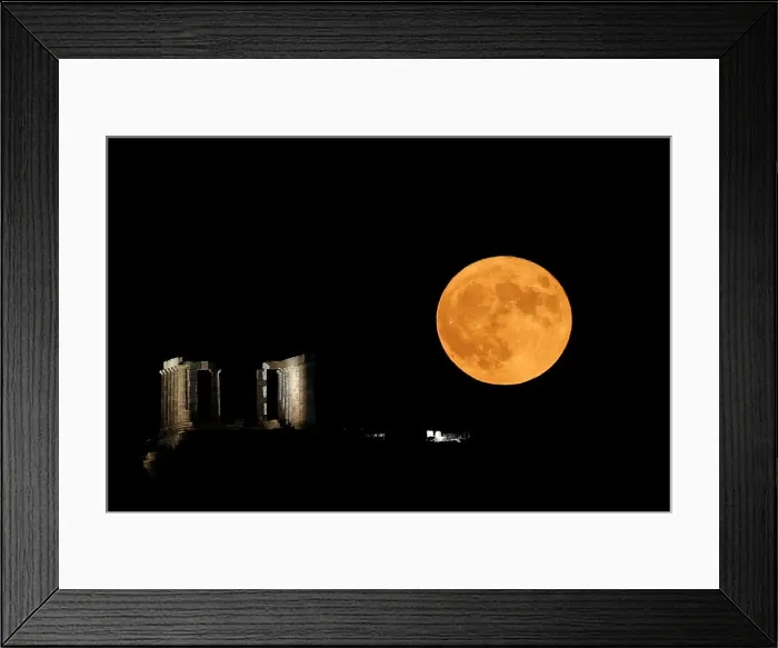 Framed Print : A full moon rises behind the Temple of Poseidon in Cape Sounion, near Athens Framed Print : A full moon rises behind the Temple of Poseidon in Cape Sounion, near Athens