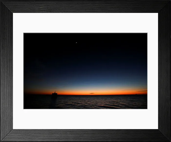 Framed Print : Sunrise is seen over the Rio de la Plata river in Buenos Aires Framed Print : Sunrise is seen over the Rio de la Plata river in Buenos Aires