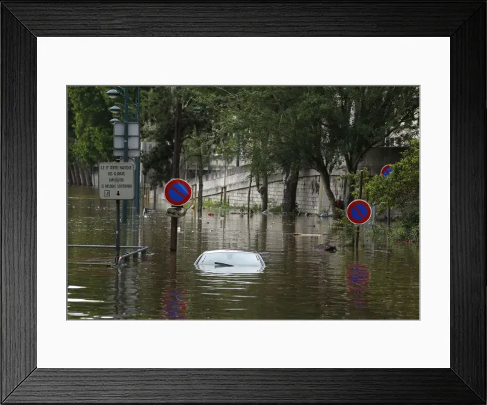 Framed Print : An abandoned car is submerged in deep water on the flooded river-side of the River Seine Framed Print : An abandoned car is submerged in deep water on the flooded river-side of the River Seine