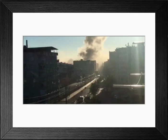 Framed Print : Video still shows smoke rising from an explosion in a Diyarbakir