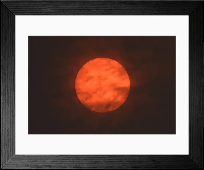 Framed Print : The sun is seen after dawn after the Met Office reported that storm Ophelia has drawn