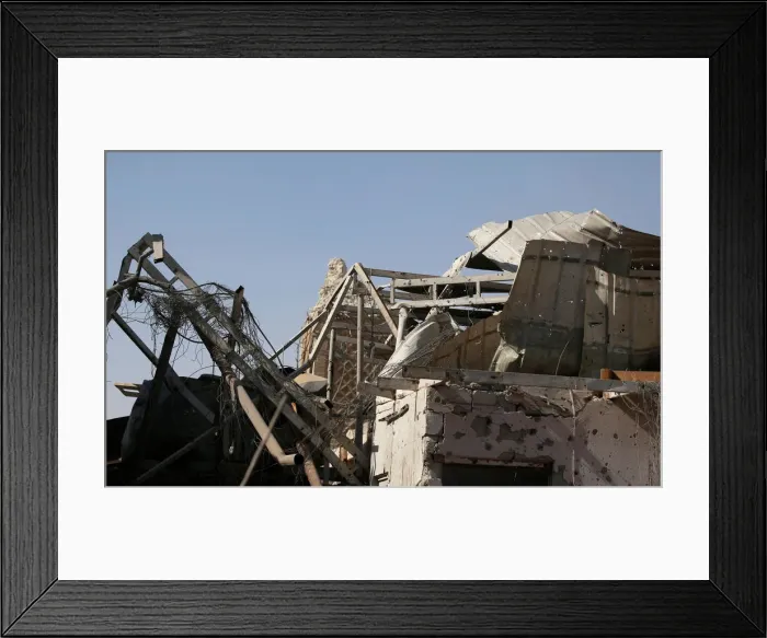 Framed Print : The remains of al-Hadba minaret at the Grand al-Nuri Mosque is pictured behind the ruins Framed Print : The remains of al-Hadba minaret at the Grand al-Nuri Mosque is pictured behind the ruins
